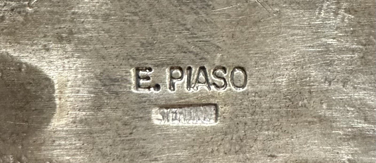 Hallmark of E. Piaso, reading E. PIASO