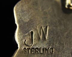 Hallmark of John Wolf Navajo, reading JW