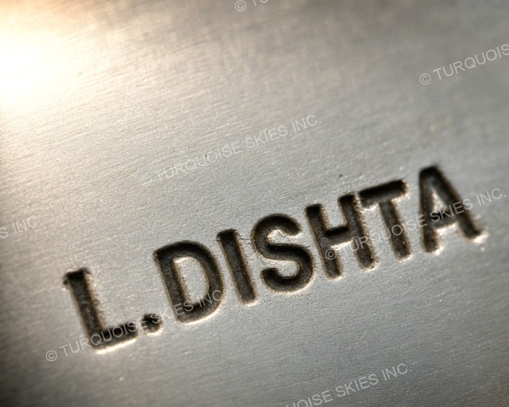 Hallmark of Lena Dishta, reading L.DISHTA