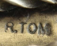 Hallmark of Ronald Tom, reading R.TOM