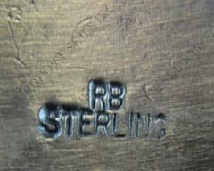 Hallmark of Running Bear Group, reading RB