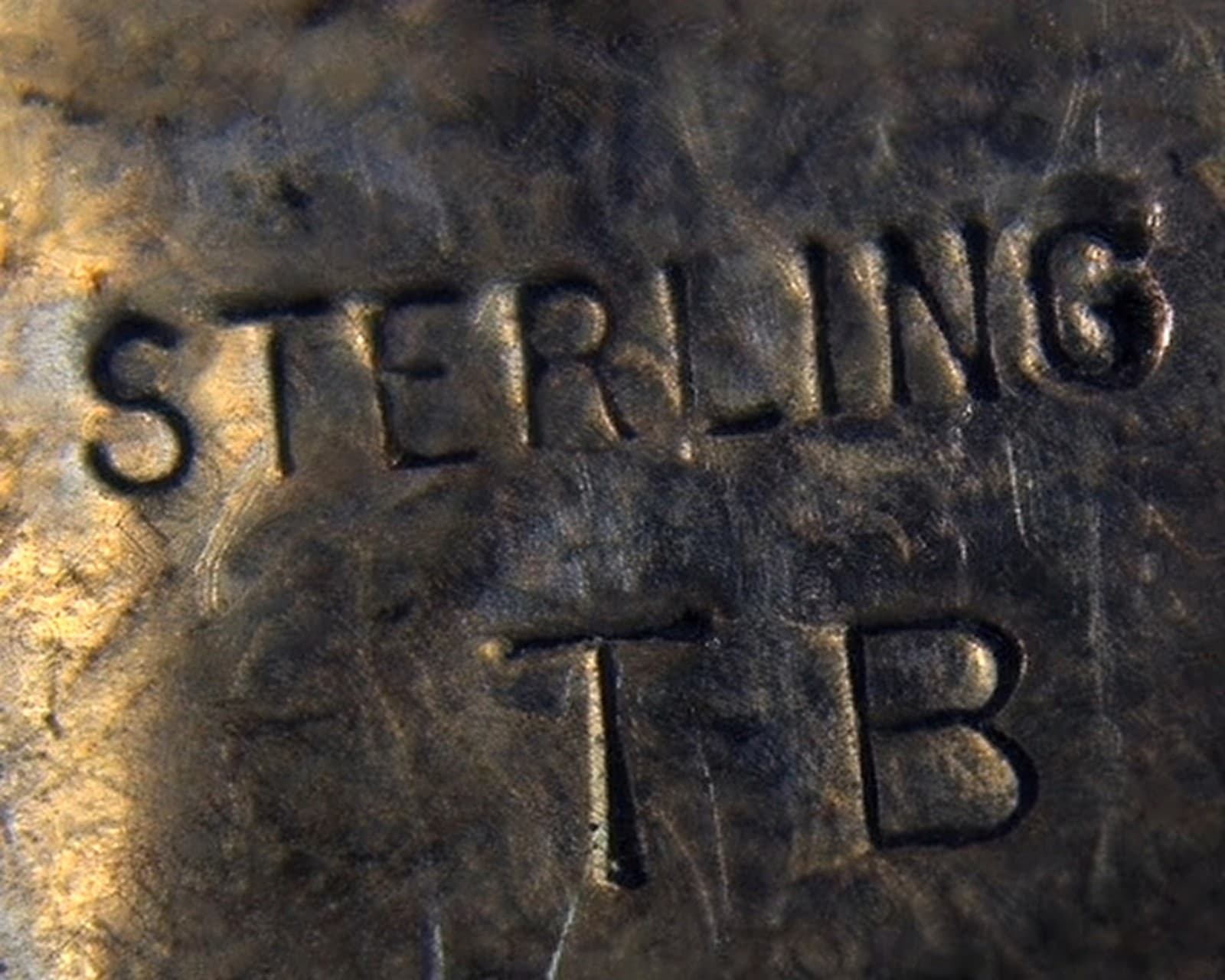 Hallmark of Tom Billy, reading TB