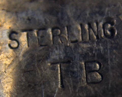 Hallmark of Tom Billy, reading TB