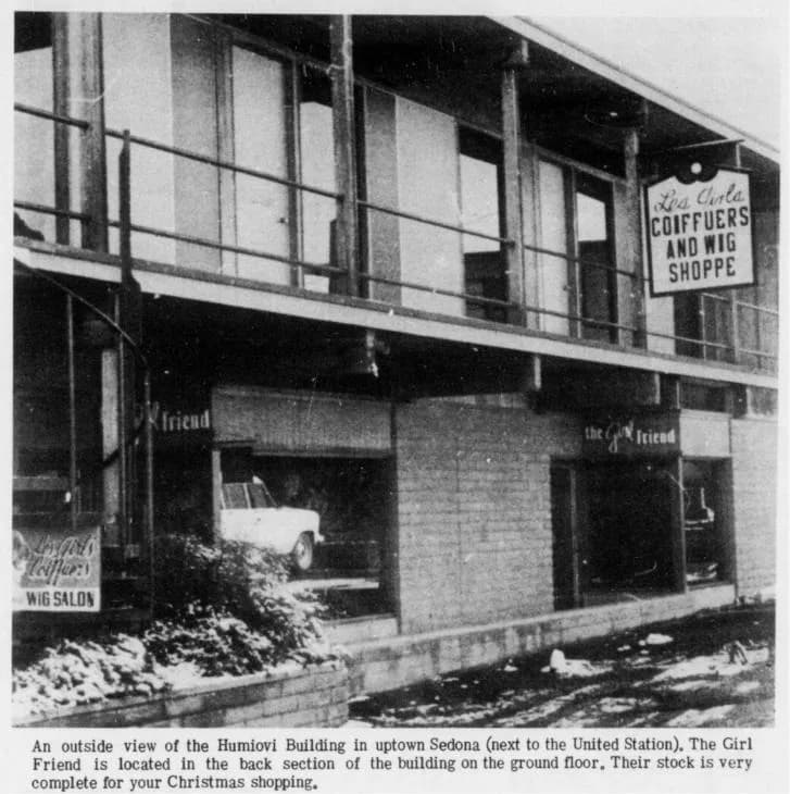 Black-and-white newspaper photograph of the two-story Humiovi Building in Uptown Sedona, with its balcony, spiral stair and snow along the walk, December 1972