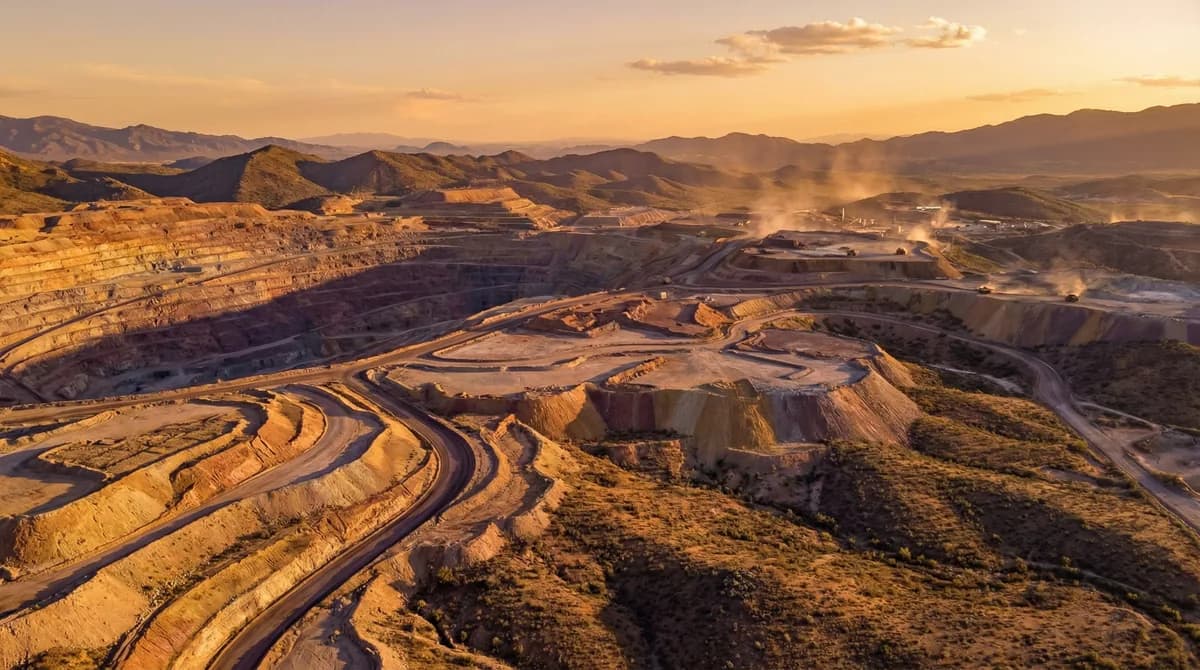 Aerial view of the Globe-Miami mining district with terraced copper benches and long purple shadows