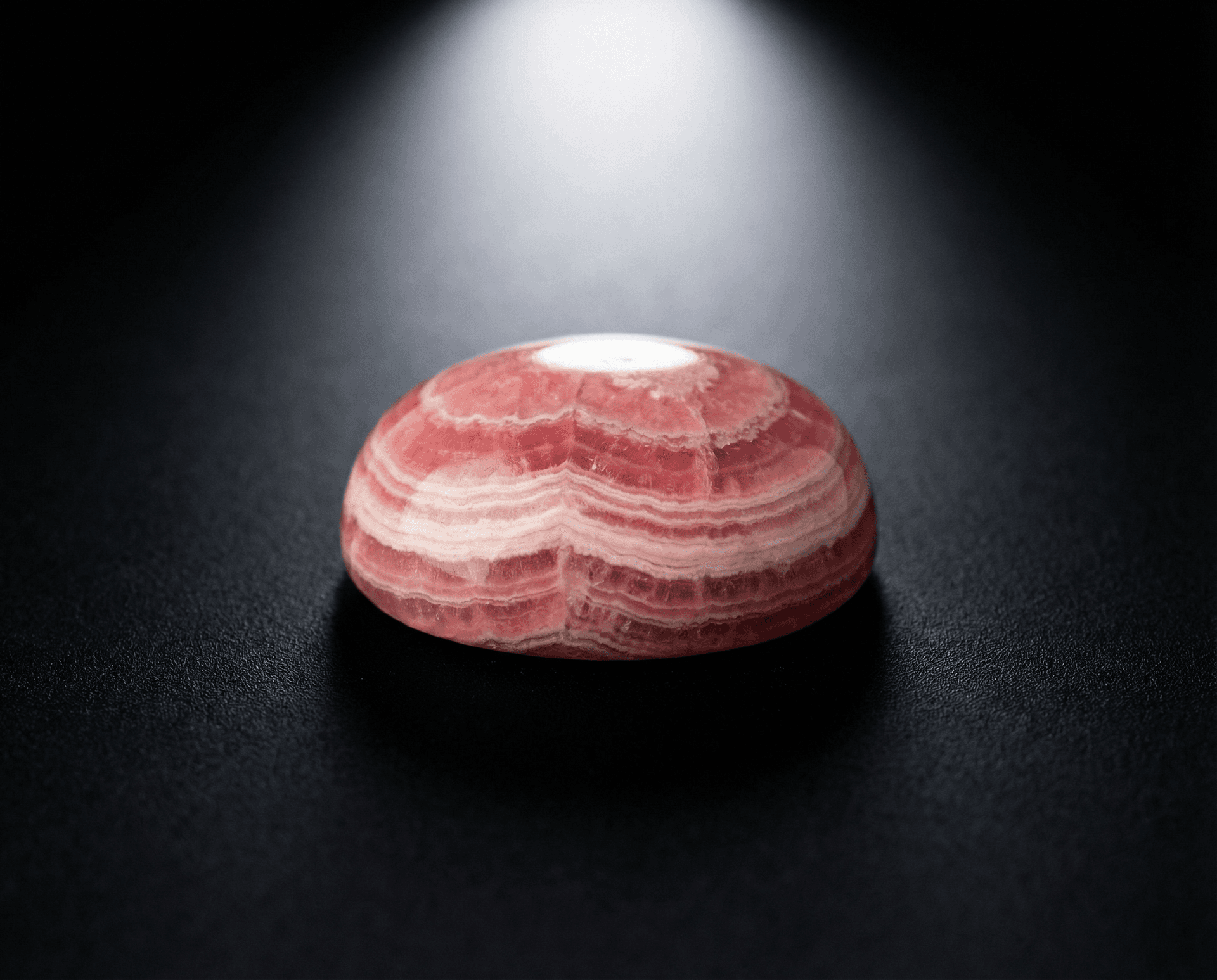 Polished Rhodochrosite cabochon