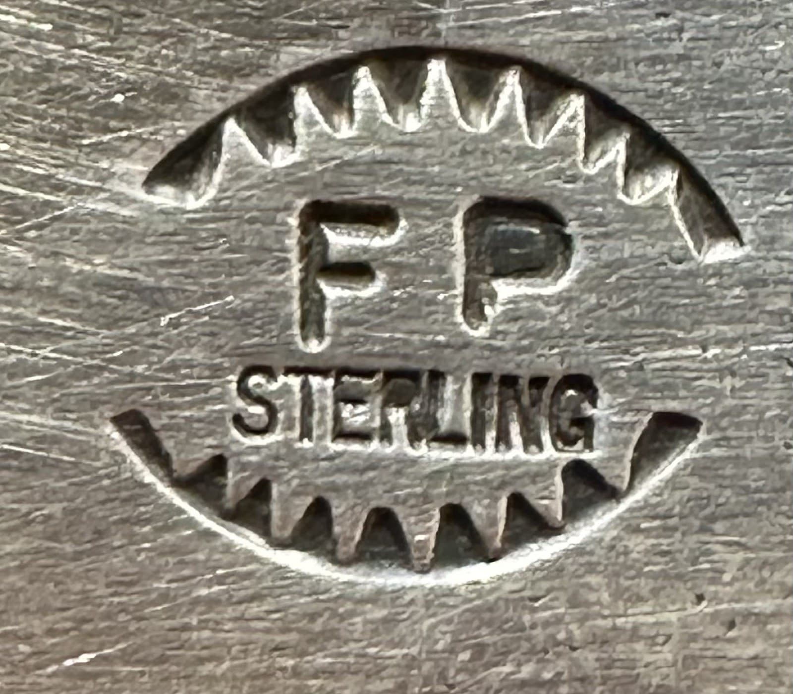 The “FP” mark of Frances Peter