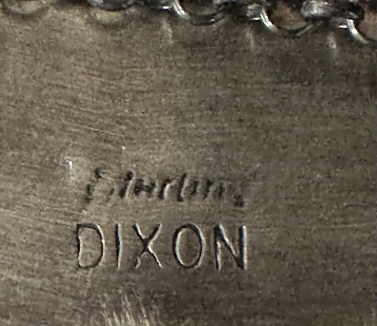 Hallmark of Johnny Dixon, reading DIXON