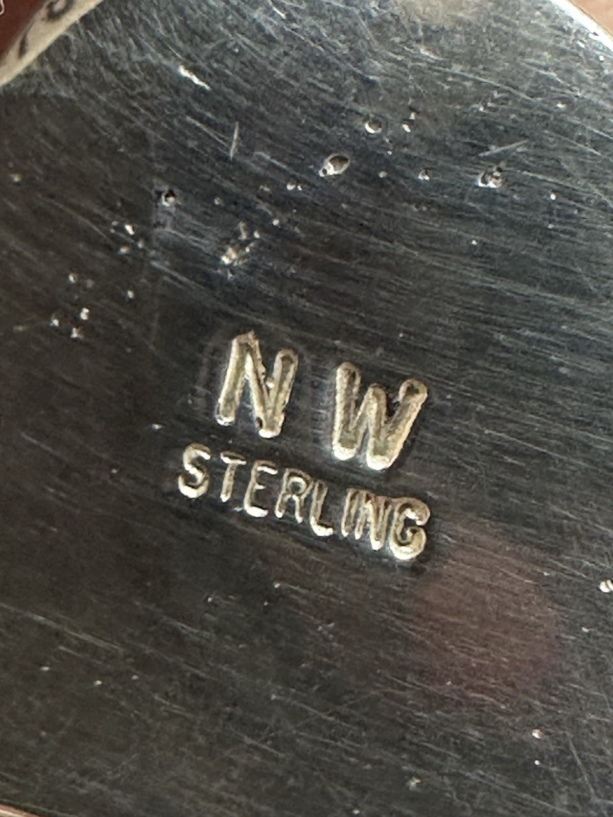 Hallmark of Norman Woody, reading NW