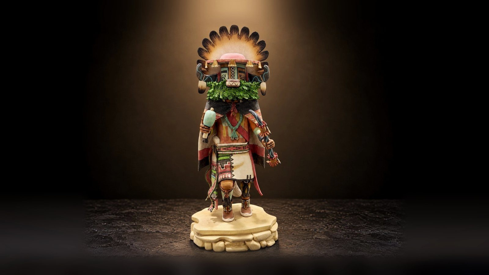 A Hopi bear kachina, signed on its base, turned through four views and on a shelf